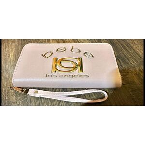 BEBE Pink and gold, large wristlet. Lots of room never used.